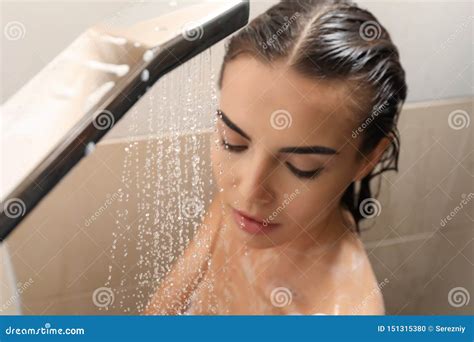 beautiful woman in shower|Beautiful woman taking shower in the bathroom, .